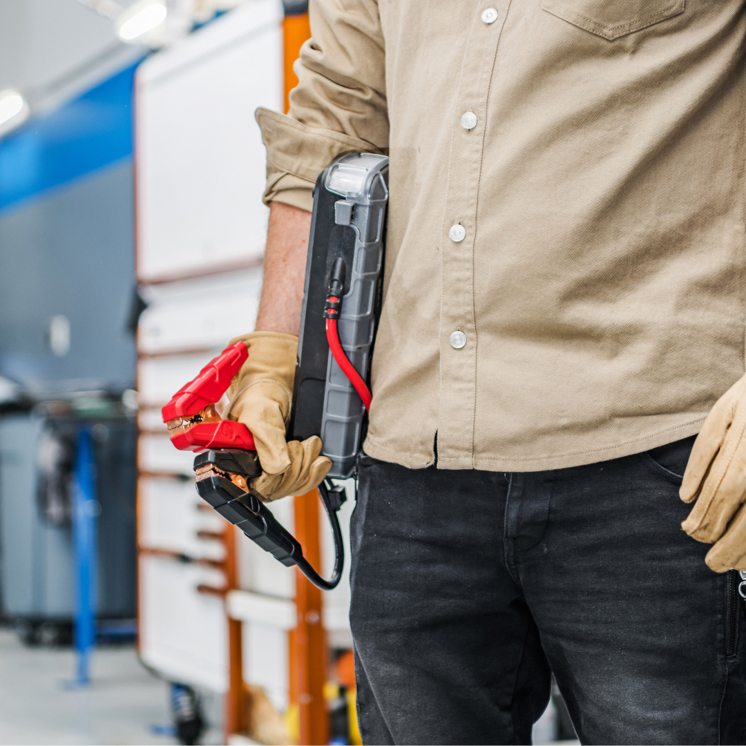 man carrying a jump starter