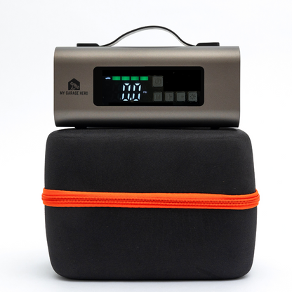 Boost N’ Inflate portable jump starter and tyre inflator placed on top of its black carry case with an orange zip, shown in a clean white studio setup with the digital display facing forward.