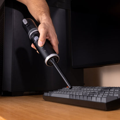 Cleaning a keyboard and desk setup with the Clean N' Go portable vacuum